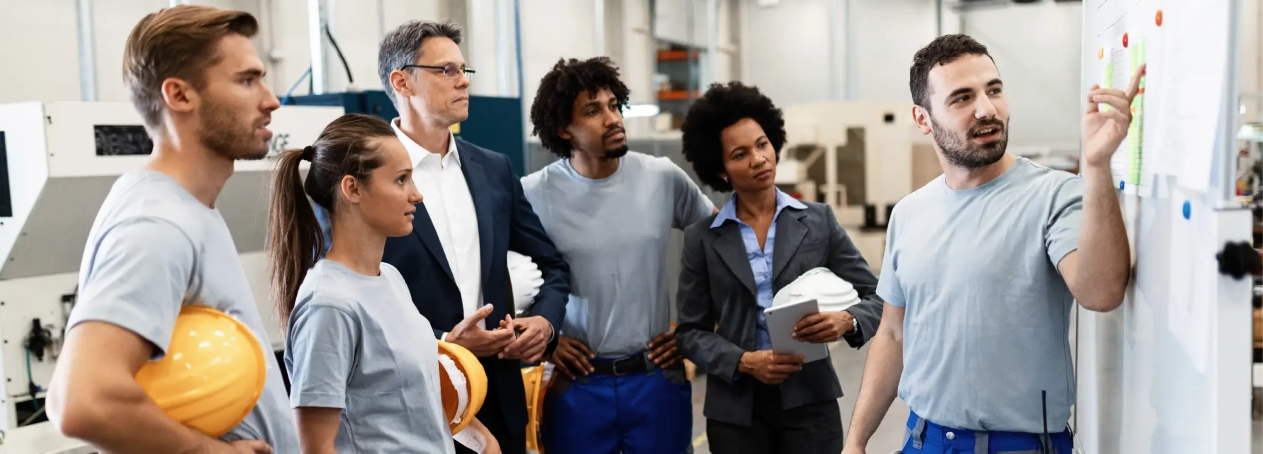 Team discussing at whiteboard